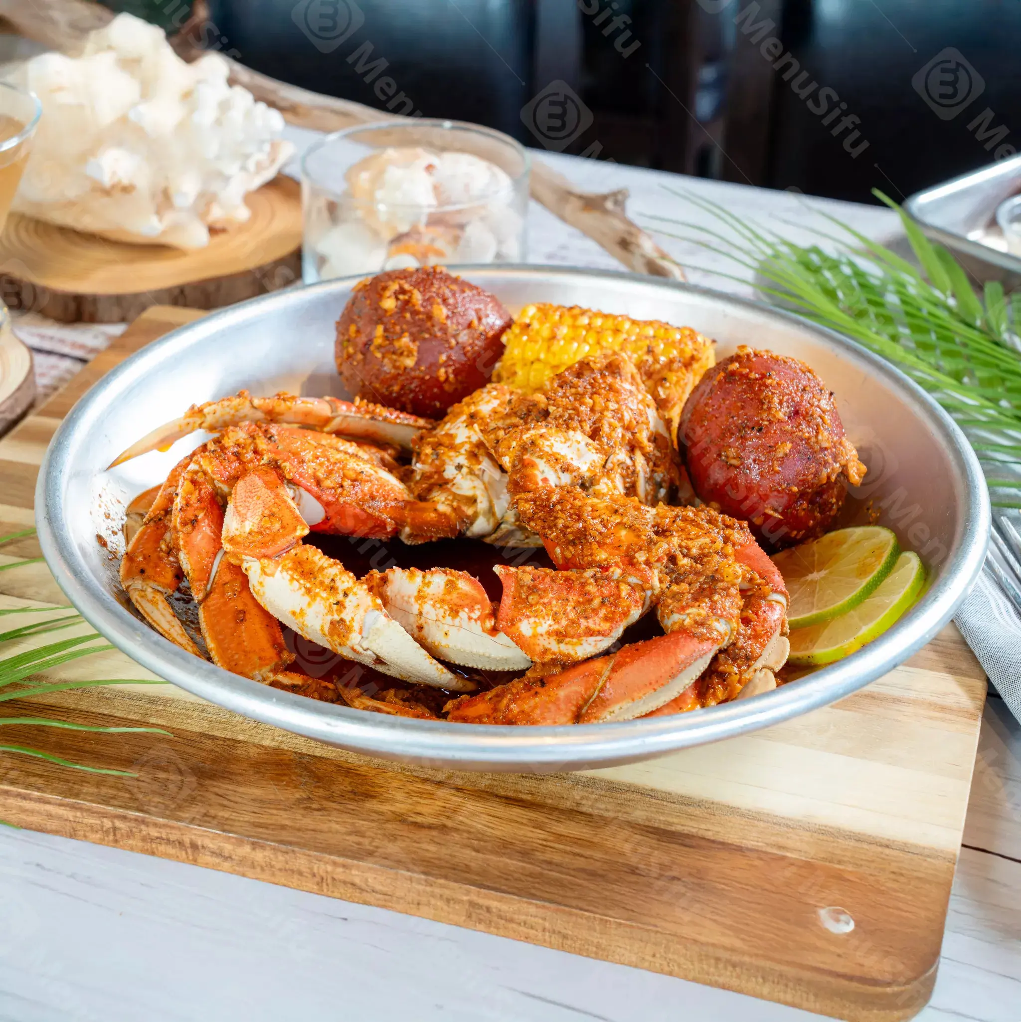 Spicy crab platter with corn and potatoes at Juicy Seafood And Bar, a Seafood Restaurant in TX