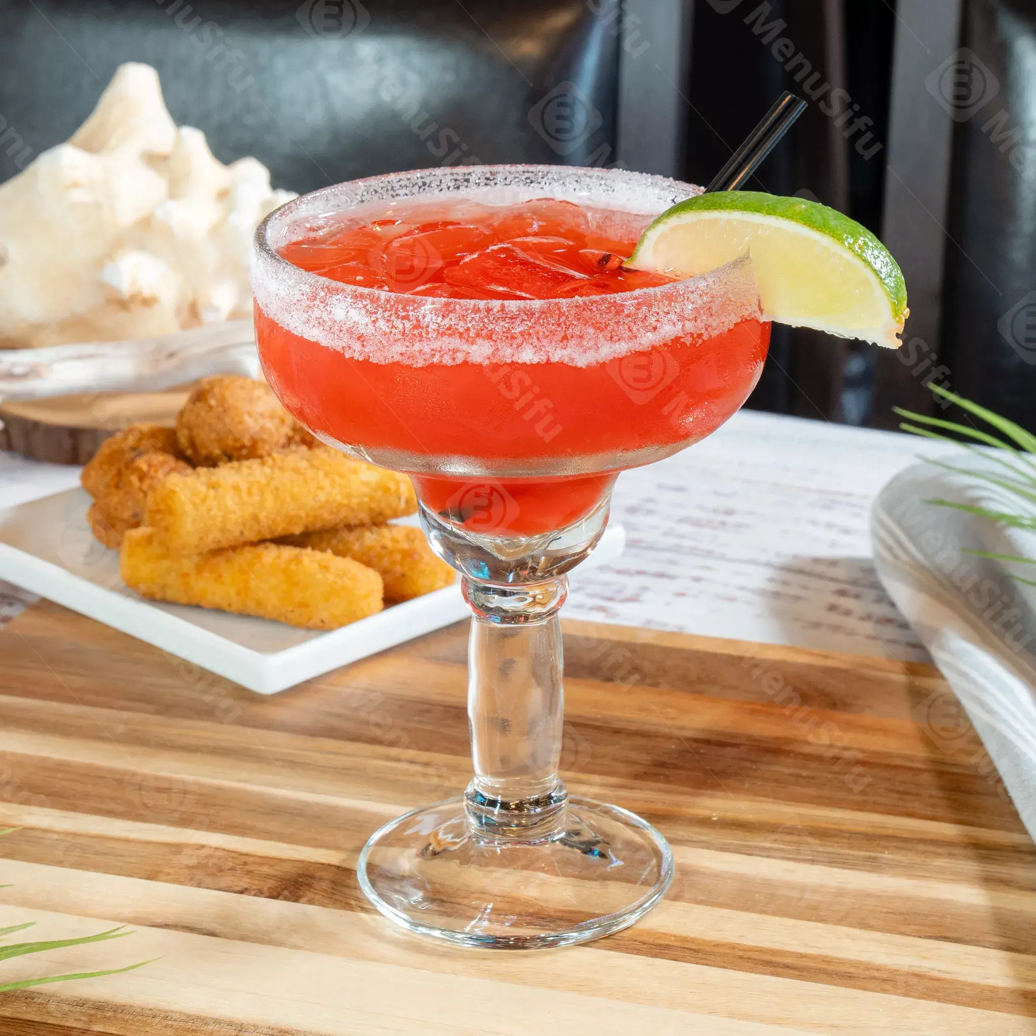 Red margarita with lime and salt rim at Juicy Seafood And Bar, a Seafood Restaurant in TX